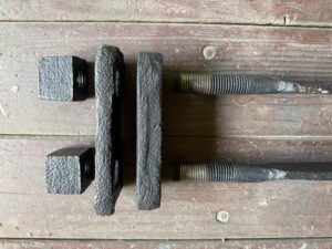 Rustic metal hardware on wooden surface.